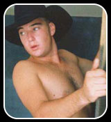 Sexy young Gareth gets sucked off through a hole in the wall!