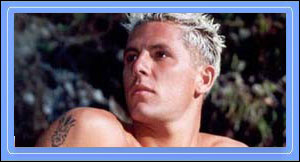 Simon loves to surf, and it shows in his rock-hard abs, wild wind-blown hair and tight little ass!